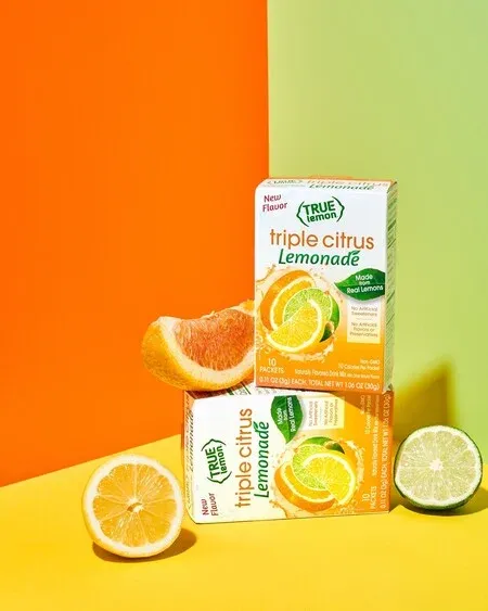 True Citrus sample packets with lemon, lime and orange slices